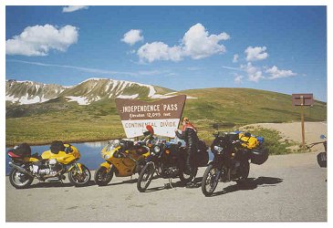 Kim D. fiddles with her luggage at Independence Pass on Independence Day