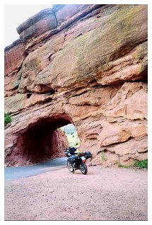 Moto Guzzi Quota provides a sense of scale for the natural tunnel at Red Rocks